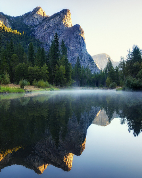 First light on Three Brothers, Yosemite National Park, California, USA (by andrew c mace).