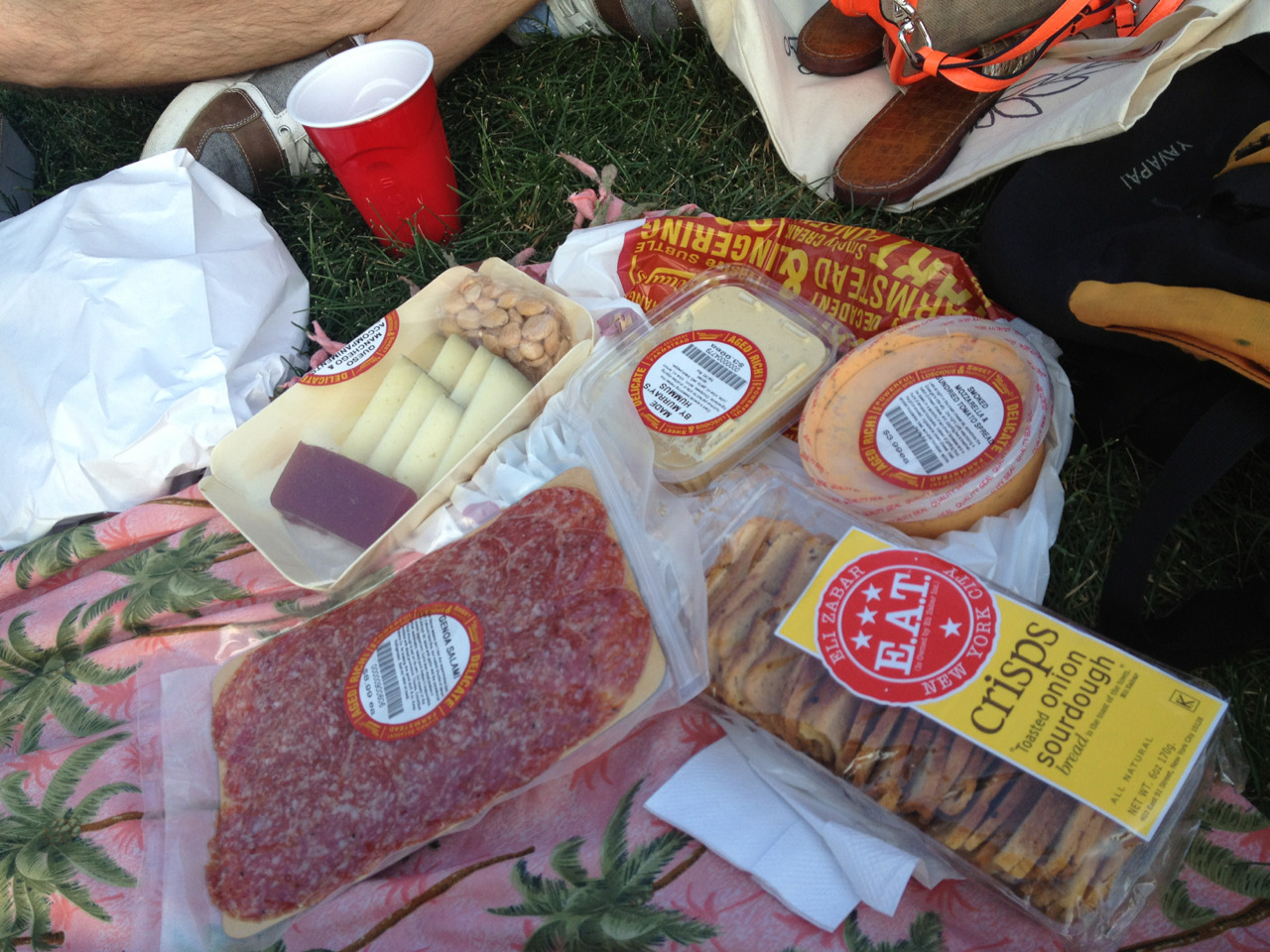 My picnic bounty from Murray’s, after begging our way in the back door even though they were closed.* Just the essentials.
*That pitcher of sangria probably helped