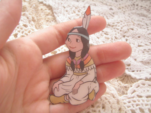 Cute as a button, Tiger Lily from Peter Pan sits in happy contentment. Brooch available at w