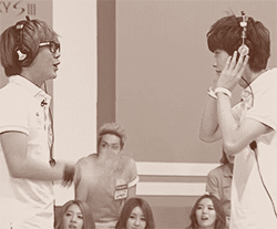 mir and jinyoung playing some sort of charade game