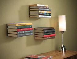 everintheirfavor:   Invisible Floating Wall Shelf by Umbra  Just as the name would suggest, this invisible book shelf screws directly into a wall stud, and creates the illusion that your reading material is simply floating on the wall. The conceal book