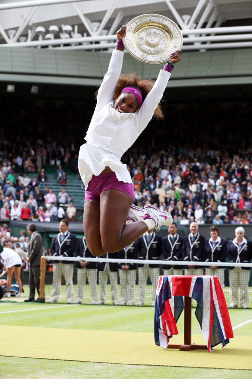gettyimages:Jump for Joy - Serena Captures a 5th Wimbledon Title:Serena Williams of the USA jumps in