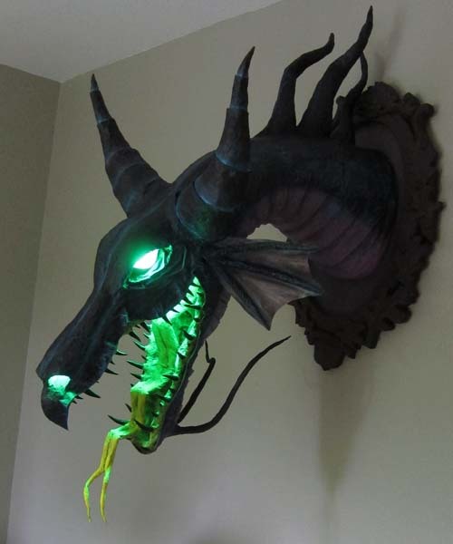 -never-is-a-promise-:  vintagereaper:     Maleficent Dragon Trophy by Dan Reeder  (source: papermacheblog / via: io9)     I want this so bad!   this is so cool!