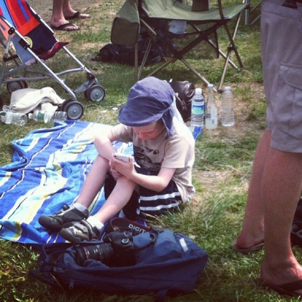 Mom Photo: kid at #acwsnewport would rather follow @americascupLIVE #twitter #WeLoveDigitalKids (Taken with Instagram)