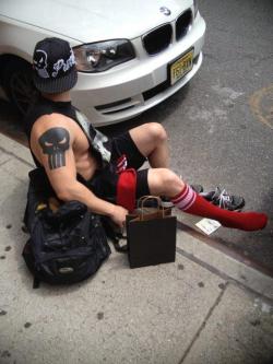 on the curb while putting on his np socks…..