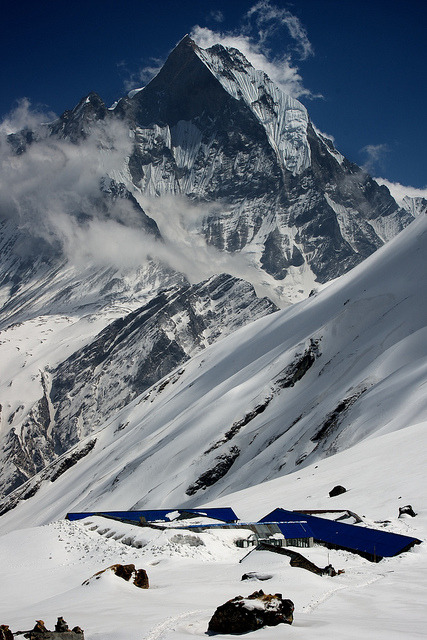 Annapurna Base Camp under the peak of Macchapucchre, Nepal (by nathan.c.potter).
