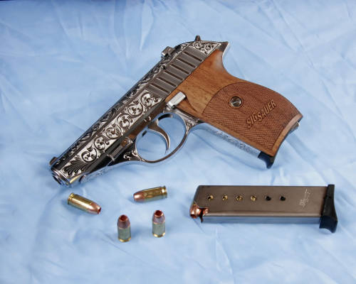 pimpingweapons: “I had this little SIG 232 SL done by Gary Richards Engraving at www.gren