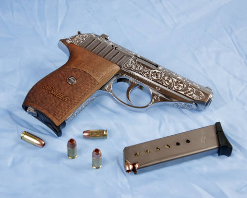 pimpingweapons: “I had this little SIG 232 SL done by Gary Richards Engraving at www.gren