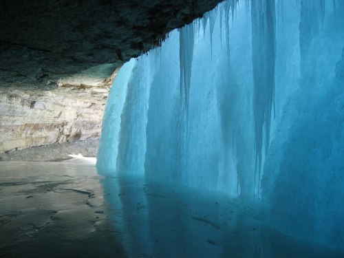 Behind a frozen waterfall.