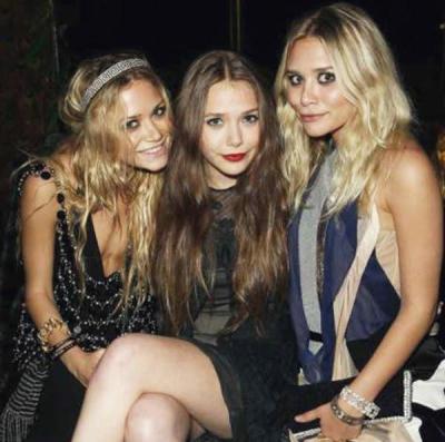 suicideblonde:
“ Elizabeth Olsen (center) with Mary Kate Olsen and Ashley Olsen in 2007
”