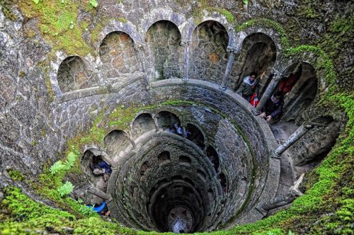 emmakale:Quinta da Regaleira - Sintra, PortugalAn underground tunnel with a spiral staircase, suppor