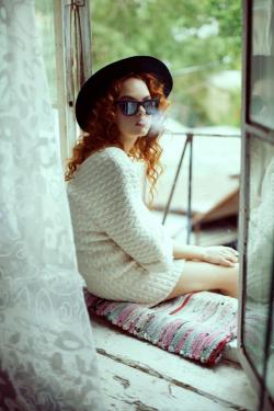 Sunglasses redhead smoking outdoor.