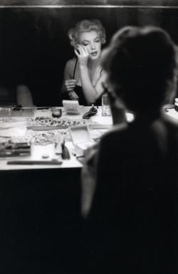   Marilyn photographed applying her make