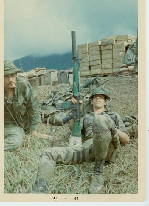 ropaire:  Navy SEALs chillin’ near their foxholes. Things to note, tigerstripe camouflage uniform, the custom paint job on the 16 as well as the suppressor. Considered pretty groovy back then. 