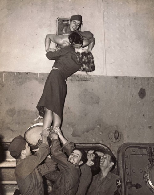  Soldiers leaning out of train windows to kiss their girls goodbye before they left for the war.  