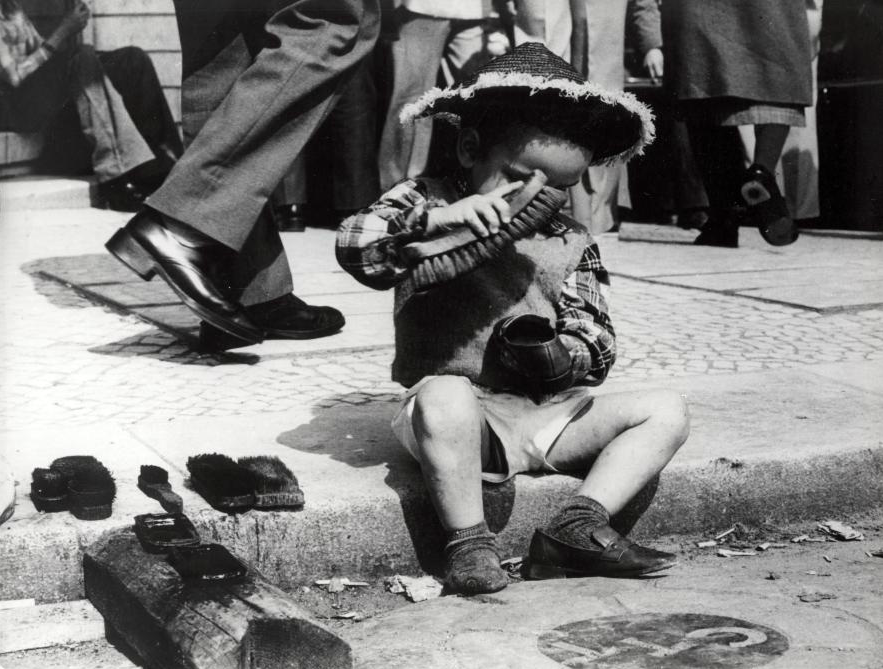 Unknown Photographer, NL. Child polishing shoes - Lisbon, Portugal, 1977