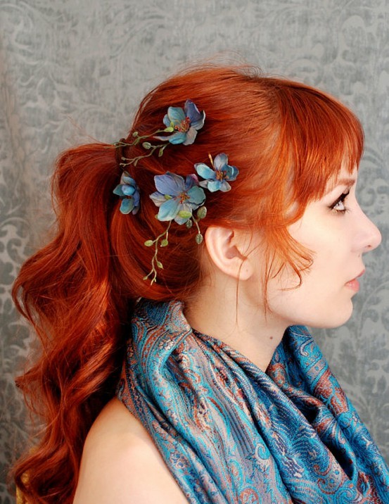 Blue flower, redhead hairstyle.