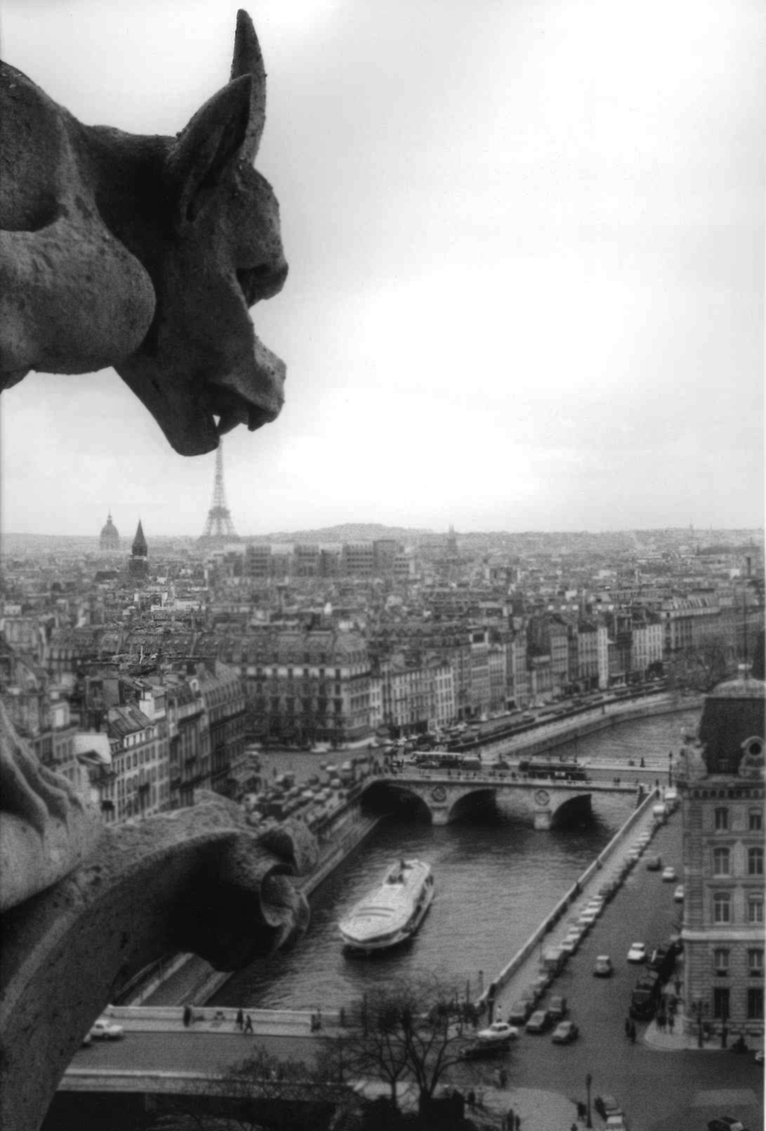onlyoldphotography:  Robert Doisneu: La gargouille de Notre Dame, April 1969 // 