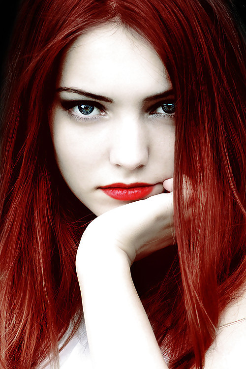 Red hair and lipstick.