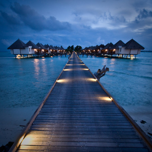 Four Seasons Resort at night, The Maldives (by Christopher Charles White).