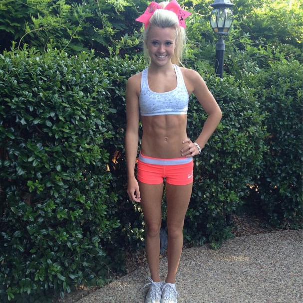 iamcheerleading:  jumpstunttumble:  i love that sports bra!  I WANT THAT SPORTS BRA