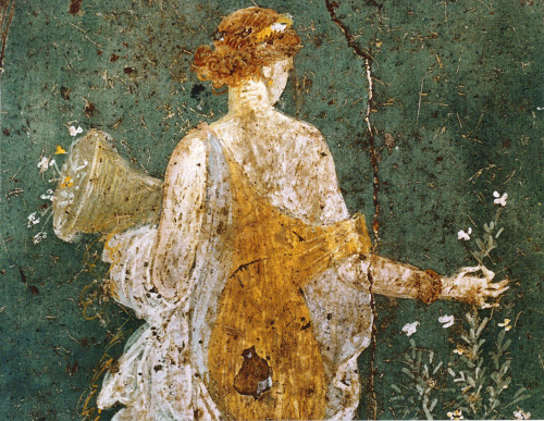 arthistorygeeks:Flora, woman picking flowers with a cornucopia in the ruins of Pompeii,  1-45  AD.