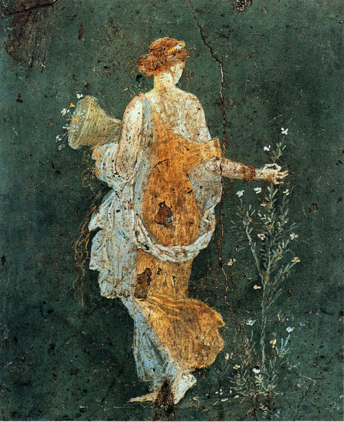 arthistorygeeks:Flora, woman picking flowers with a cornucopia in the ruins of Pompeii,  1-45  AD.  