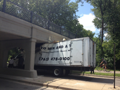 This truck driver was not having a good day today. Truck topper slammed into a bridge over by Lake Calhoun, Minneapolis.