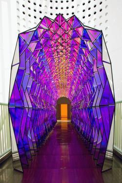 asylum-art: Olafur Eliasson: One Way Colour Tunnel  2007 Olafur Eliasson’s colorful, kaleidoscope-like glass tunnel comes to life when you stroll through it one way, but if you look back over your shoulder, the panels appear black. 