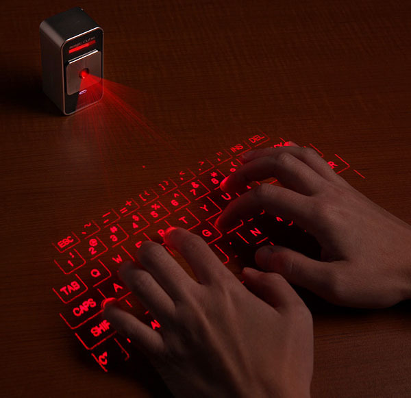 wickedgadgets:  waycoolgadgets:  The laser projection keyboard.  Sooooo…. I need