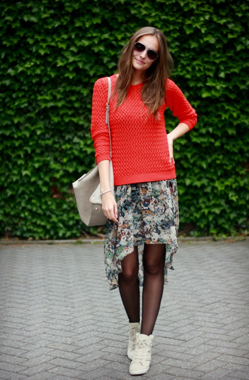 Black tights, beige tennis, flower print skirt and red crochet sweater