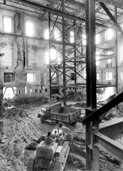 usnatarchives:Heavy construction equipment is driven inside the shell of the White House during reno