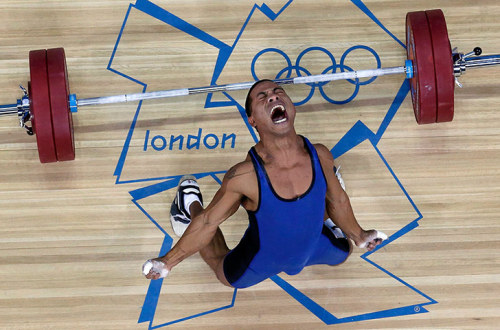  Micronesia’s Manuel Minginfel drops his lift during the men’s 62Kg group B weightliftin