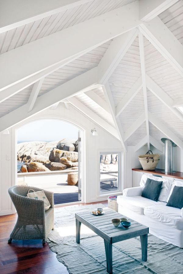 When you have a stunning view of the ocean, let that be the focus of your home. Bright white walls and simple furniture makes the waterfront location take center stage. This is where I want to spend my summer days!