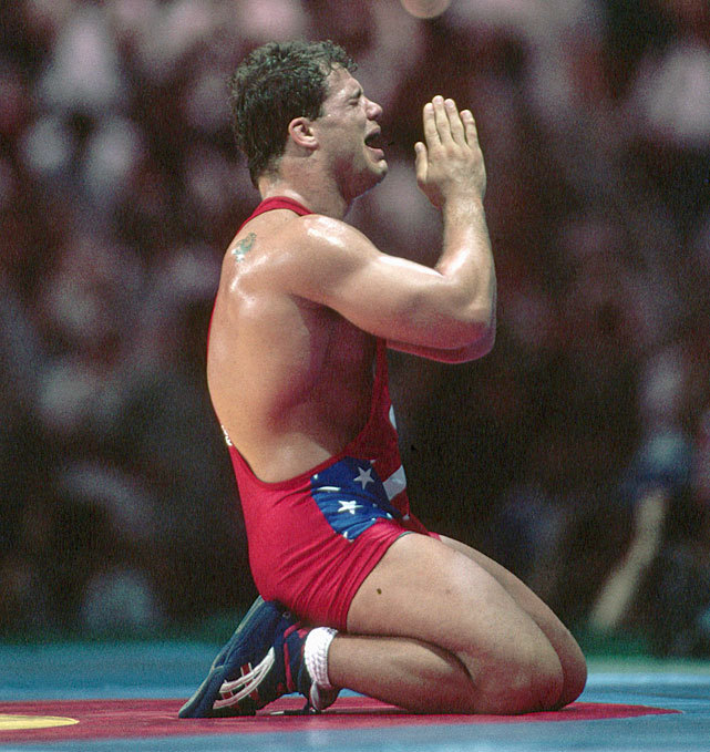 Kurt Angle falls to his knees after winning gold at the 1996 Olympics in Atlanta. Angle defeating Iranian Abbas Jadidi by officials’ decision after the competitors wrestled to an eight minute, 1-1 draw in the freestyle heavyweight division. (Franck...