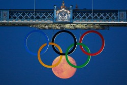 Moon Rises over the Olympic Rings at Tower