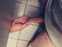 gloryholefan:  Reaching for the prize.  In the bathroom!!!!