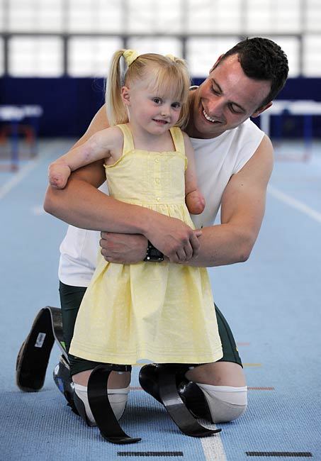 readyforsomefootball:  Oscar Pistorius runs with 5-year-old Ellie May Challis. Images taken from here, photographed by Andy Hooper. Find out more about Ellie May and her run with Oscar here.  