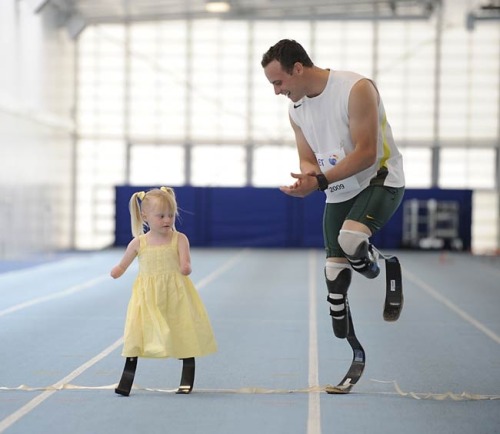 readyforsomefootball:  Oscar Pistorius runs with 5-year-old Ellie May Challis. Images taken from here, photographed by Andy Hooper. Find out more about Ellie May and her run with Oscar here.  