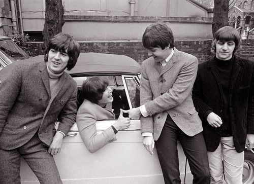  A picture of John Lennon getting his drivers license, and also a car! The other