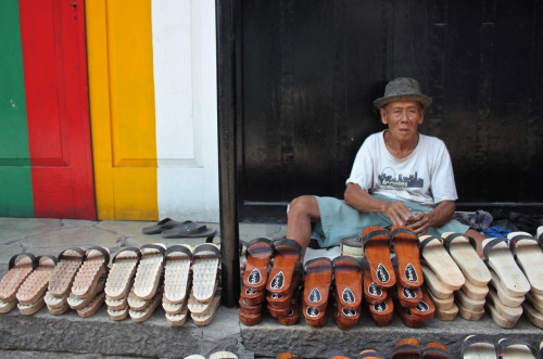 As foul and pungent smells of a nearby fish market permeated the air, this calm man happily sold ref