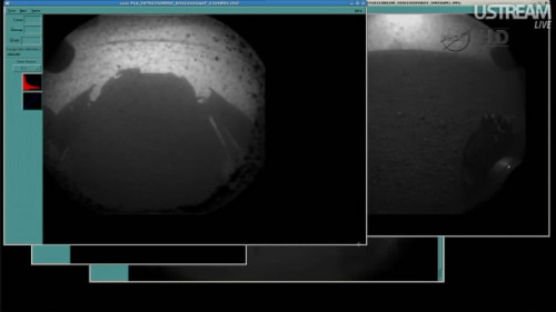 The rover Curiosity lands successfully on Mars and is able to send back images. On one we can see th
