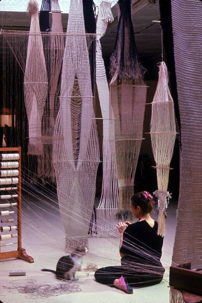 ninaslens:  Artist and weaver Lenore Tawney at work on a tapestry, circa 1966. 