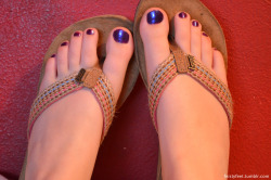 feistyfeet:  Purple toes, and the flip-flops that were given to me as a gift. They’re awesome!