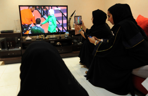 Today, in one image. Women in Riyadh watch Sarah Attar, the first woman from Saudi Arabia to compete in track and field in the Olympics. Here’s how she did in the 800m race.
Photo by Fayez Nureldine (Getty)
Correction: This post originally said that...