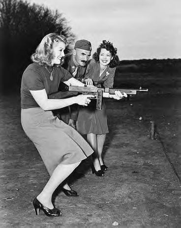 Some ladies learn how to fire a Thompson Submachine Gun.