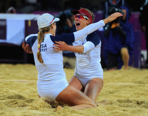 April Ross (right) of the United States and Jennifer Kessy celebrate after winning match point durin