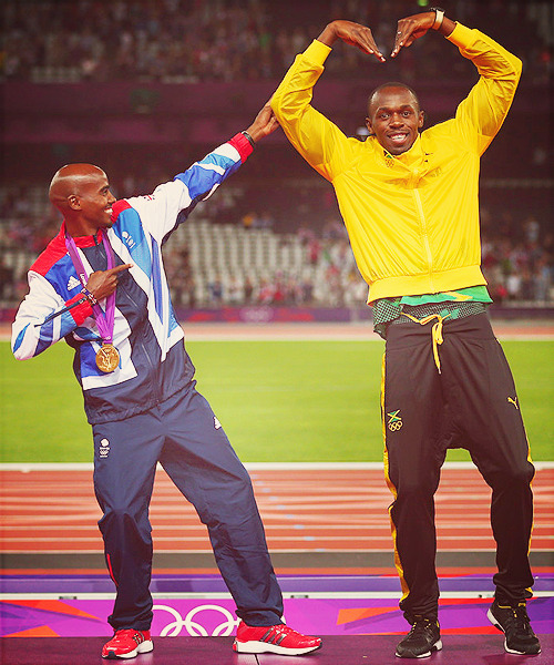 Mohamed Farah of Great Britain and Usain Bolt of Jamaica pose on the podium