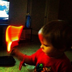 Cole and his mini light saber  (Taken with