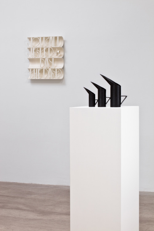 museumuesum:  installation view from Ricky Swallow at Mark Foxx, Los Angeles, California, 2011. (left) Font Study, 2011, Patinated Bronze, 21 x 19 x 3 inches (right) Penguin Pots (Soot), 2011, Patinated Bronze, 8.5 x 11.75 x 2.75 inches. 